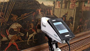 The Tracer XRF Analyzer, analyzing the composition of pigments in a painting.